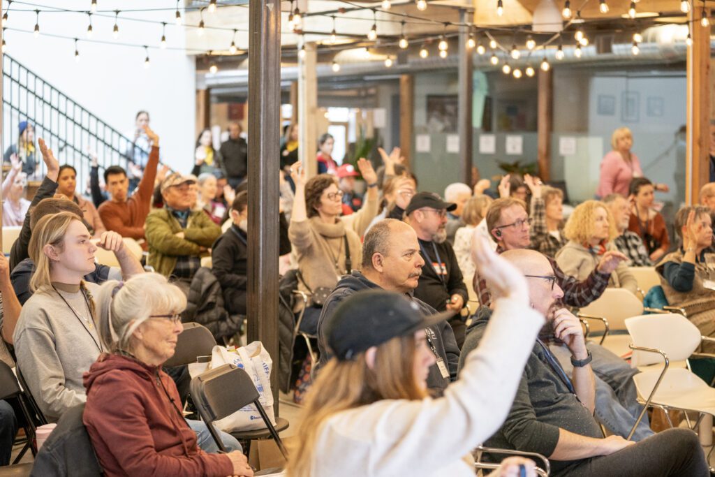 Garden Leaders raising their hands during symposium event