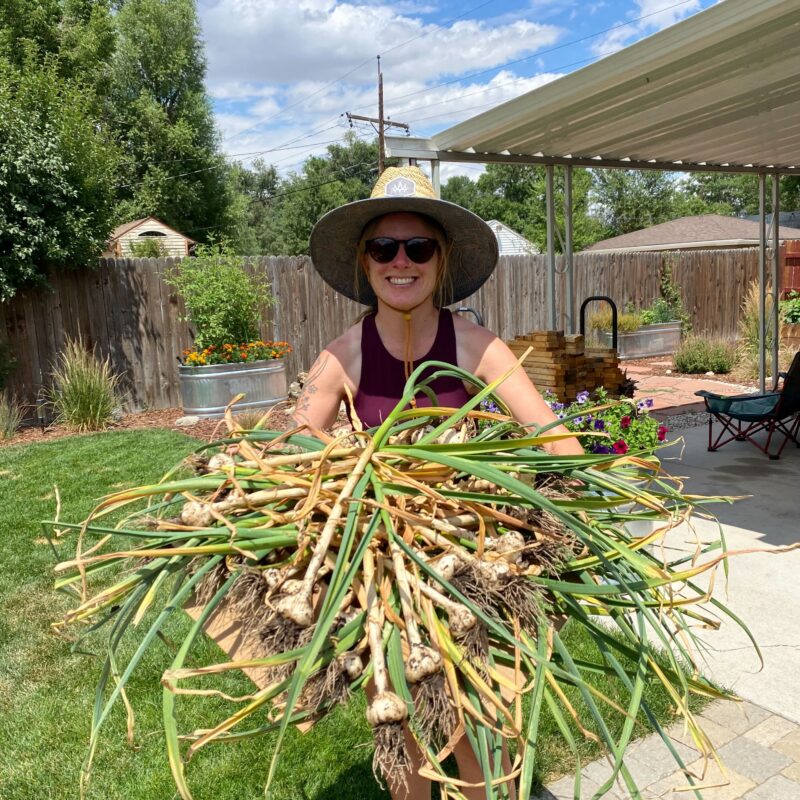 Lindsey Parker holding garlic bunch
