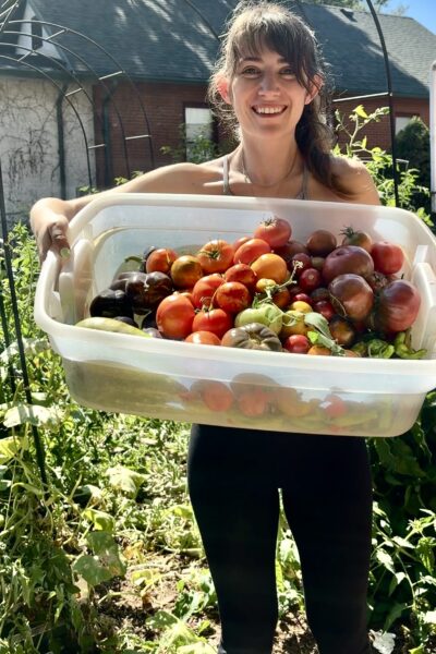 Sophie B holding a basket of tomatoes