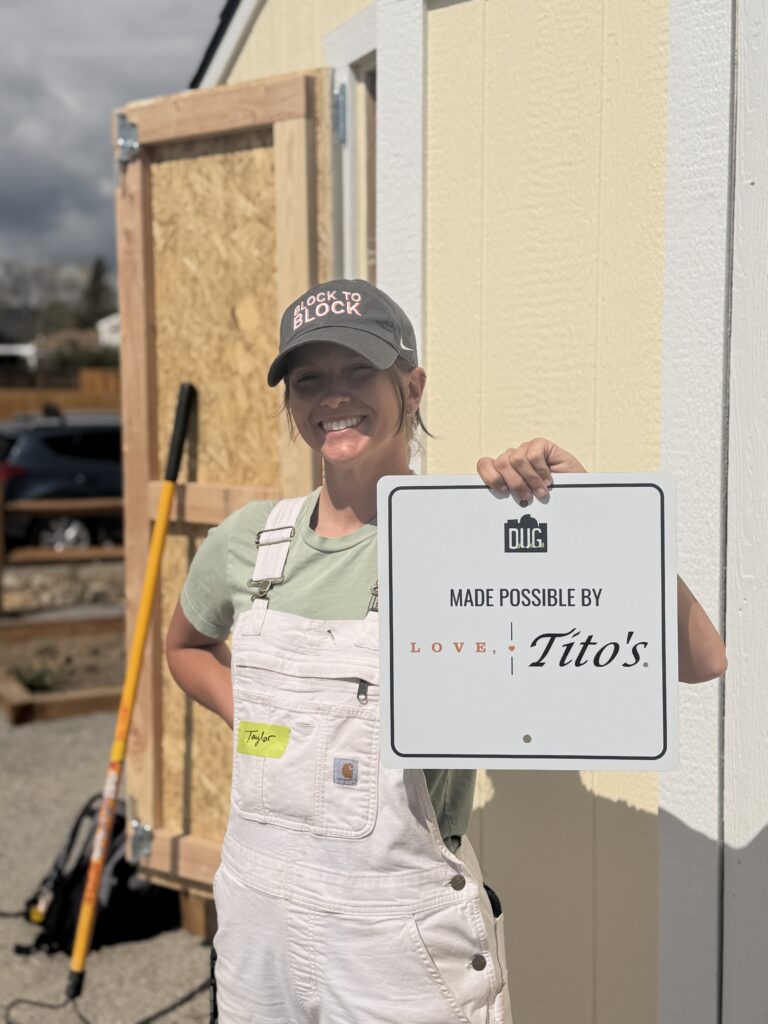 taylor holding up tito's sign 2026