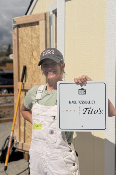 taylor holding up tito's sign 2026
