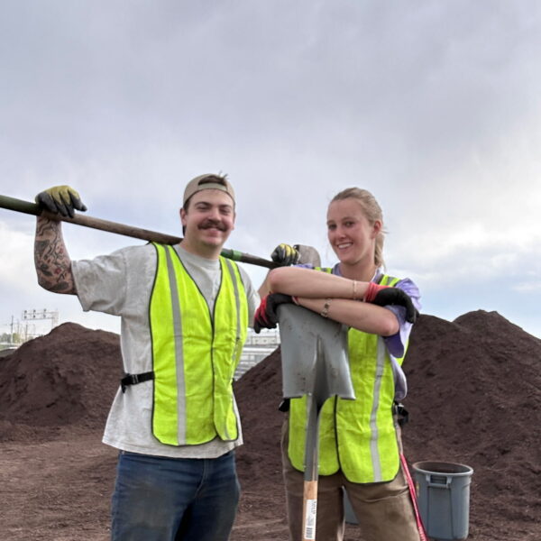 people in green vests
